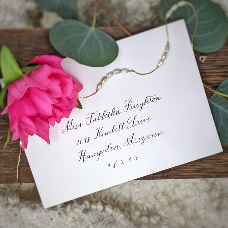Houston Texas calligraphy and engraving live events The Beaux Arts white envelope traditional script 768x768